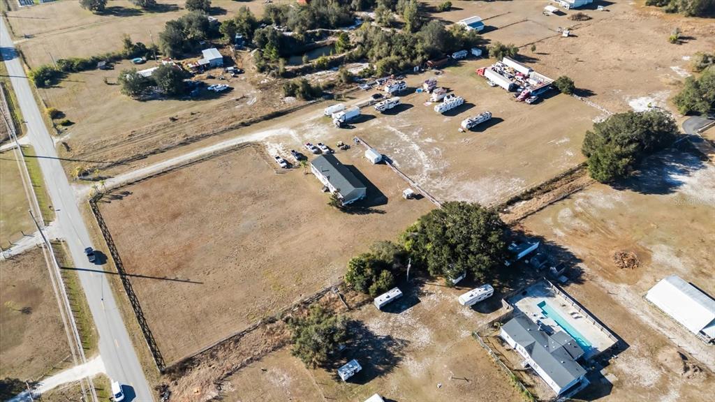 2470 Absher Road St. Cloud, FL 34771 - Photo 3 of 5 an aerial view of residential houses with outdoor space