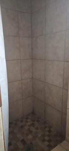 a view of a livingroom with a fireplace wooden floor and windows