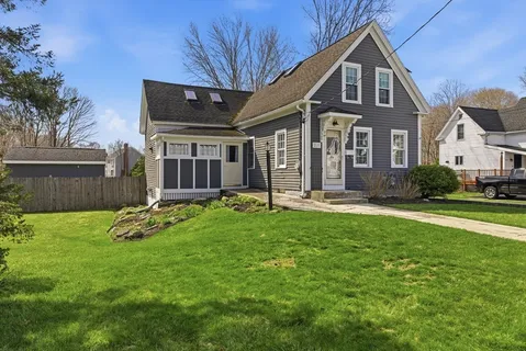 a front view of a house with a yard