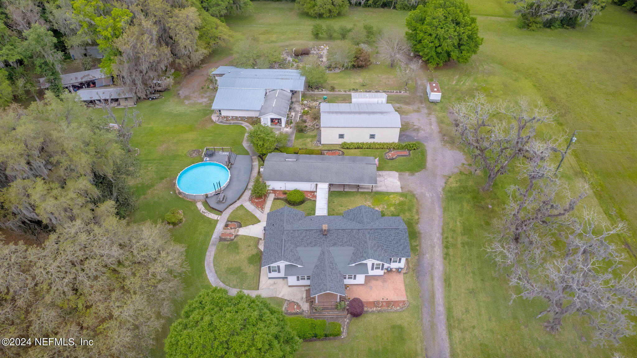 542284 Lem Turner Road Callahan, FL 32011 - Photo 1 of 84 an aerial view of a house with a swimming pool yard and outdoor seating