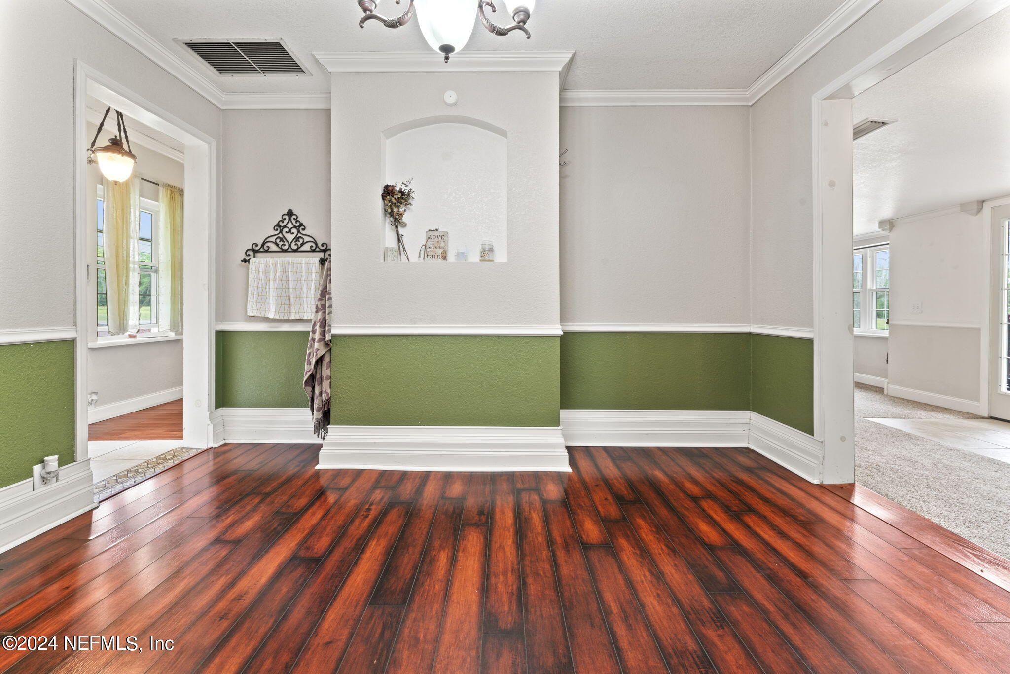 542284 Lem Turner Road Callahan, FL 32011 - Photo 20 of 84 a view of a room with wooden floor staircase and a living room