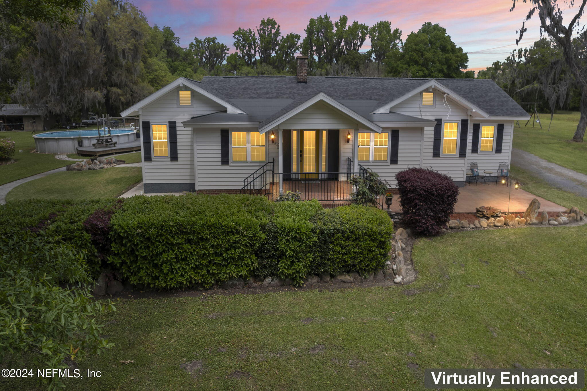 542284 Lem Turner Road Callahan, FL 32011 - Photo 2 of 84 a front view of a house with a garden