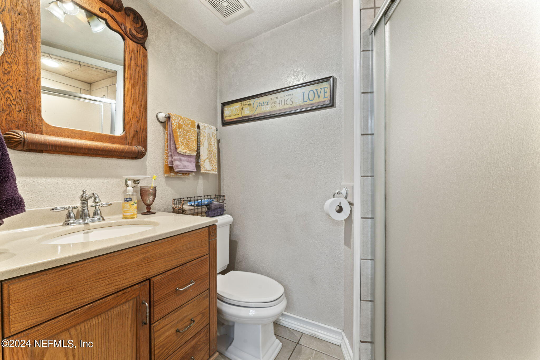 542284 Lem Turner Road Callahan, FL 32011 - Photo 28 of 84 a bathroom with a granite countertop sink toilet and shower