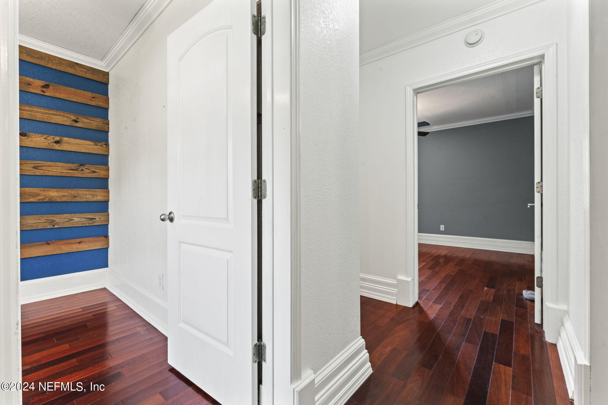 542284 Lem Turner Road Callahan, FL 32011 - Photo 34 of 84 a view of a hallway with wooden floor and closet