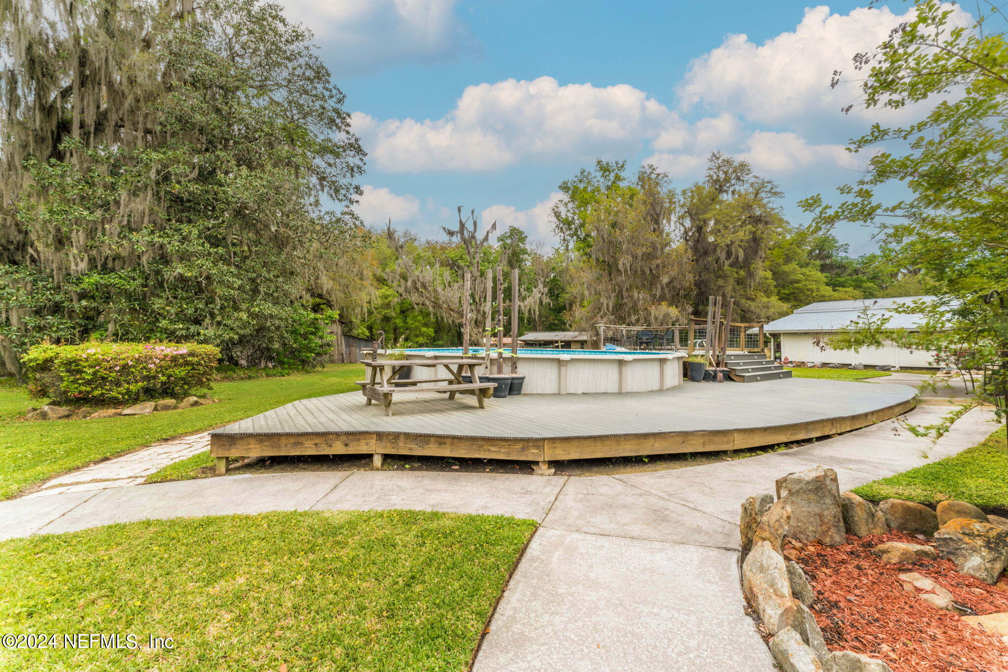 542284 Lem Turner Road Callahan, FL 32011 - Photo 53 of 84 a view of a swimming pool with an outdoor space