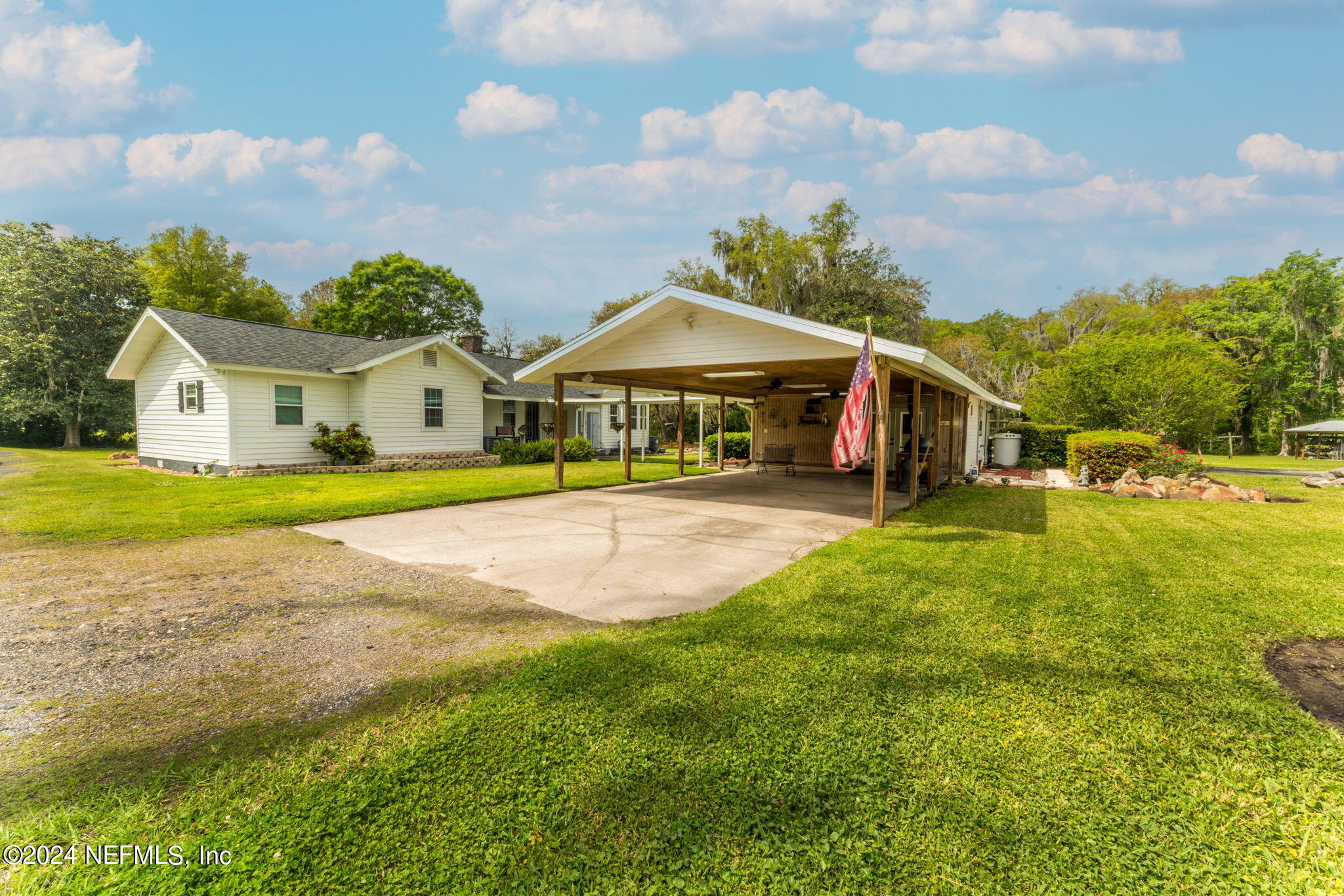 542284 Lem Turner Road Callahan, FL 32011 - Photo 60 of 84 a view of a house with a big yard and large trees