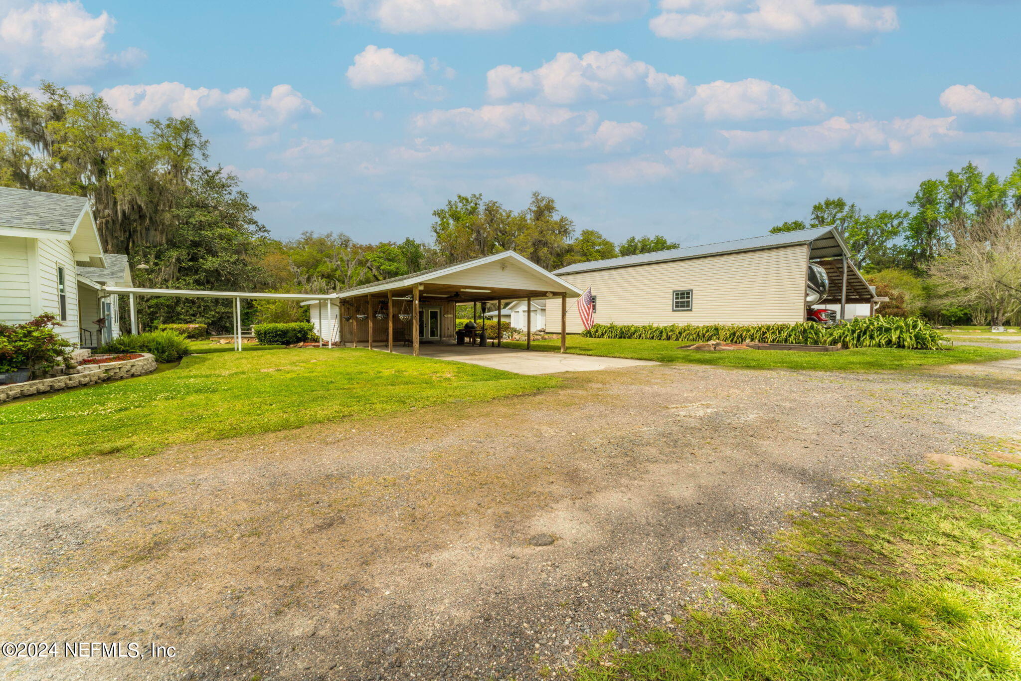 542284 Lem Turner Road Callahan, FL 32011 - Photo 61 of 84 a view of a house with a yard and potted plants