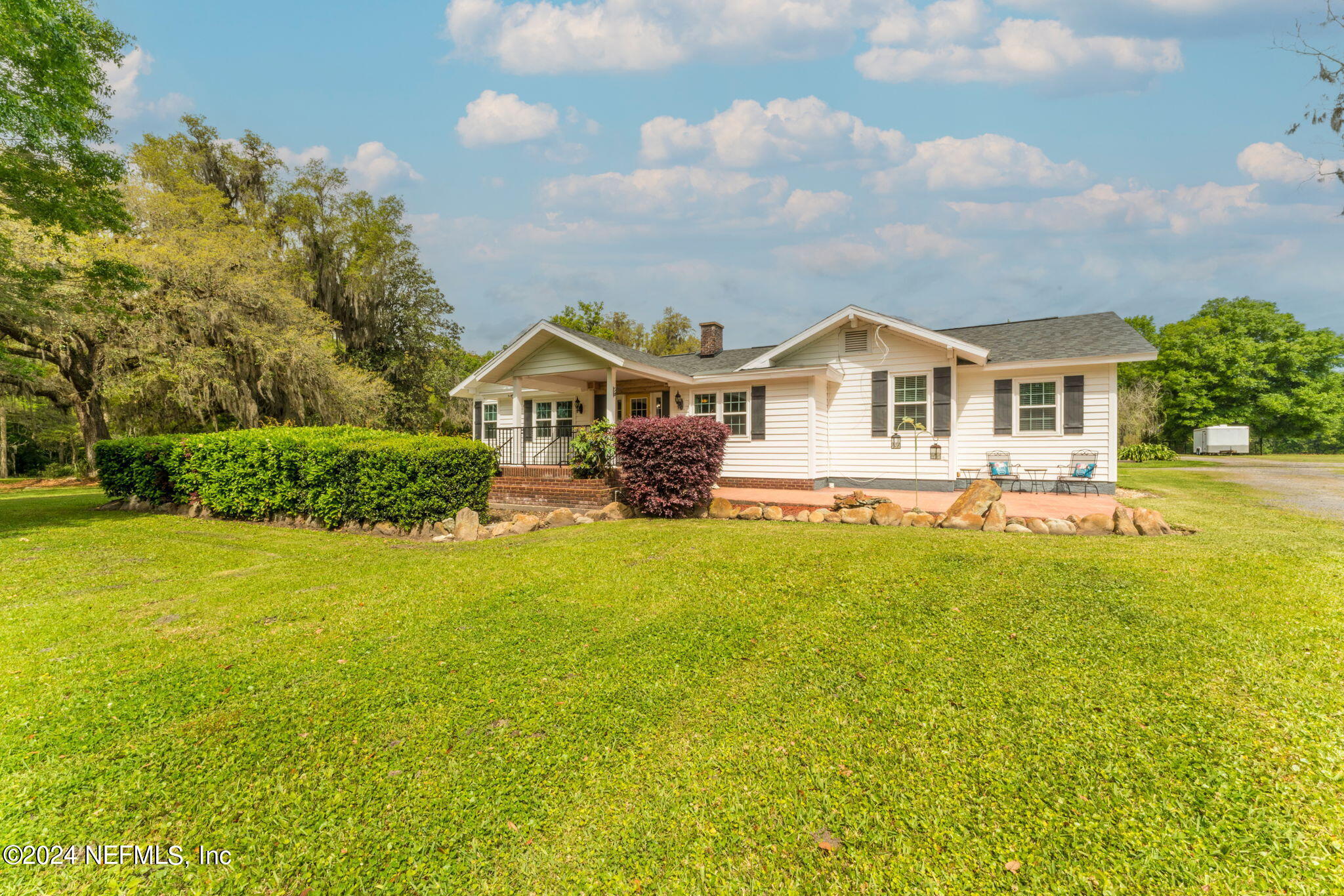 542284 Lem Turner Road Callahan, FL 32011 - Photo 62 of 84 a front view of a house with yard and green space