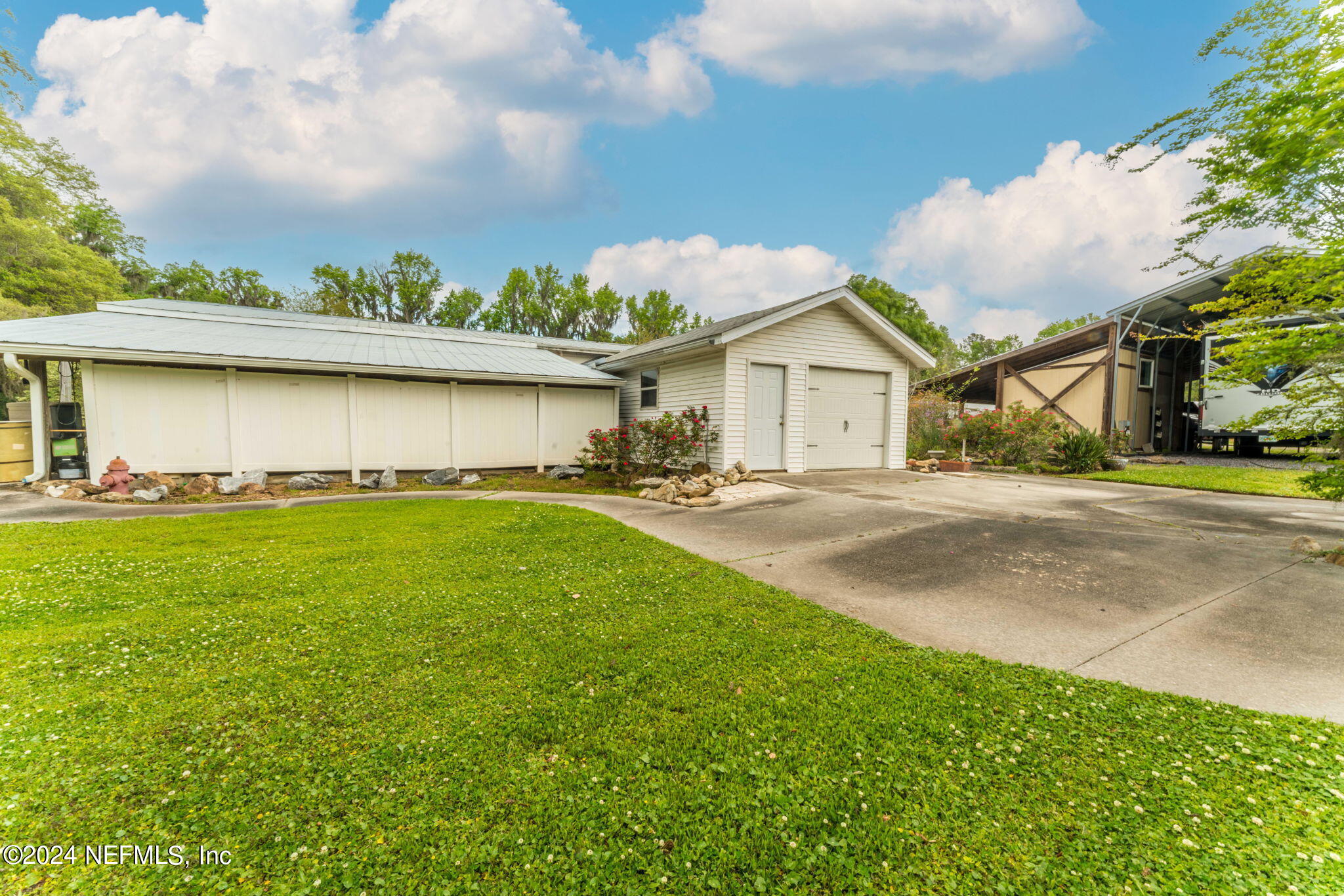 542284 Lem Turner Road Callahan, FL 32011 - Photo 71 of 84 a front view of a house with garden