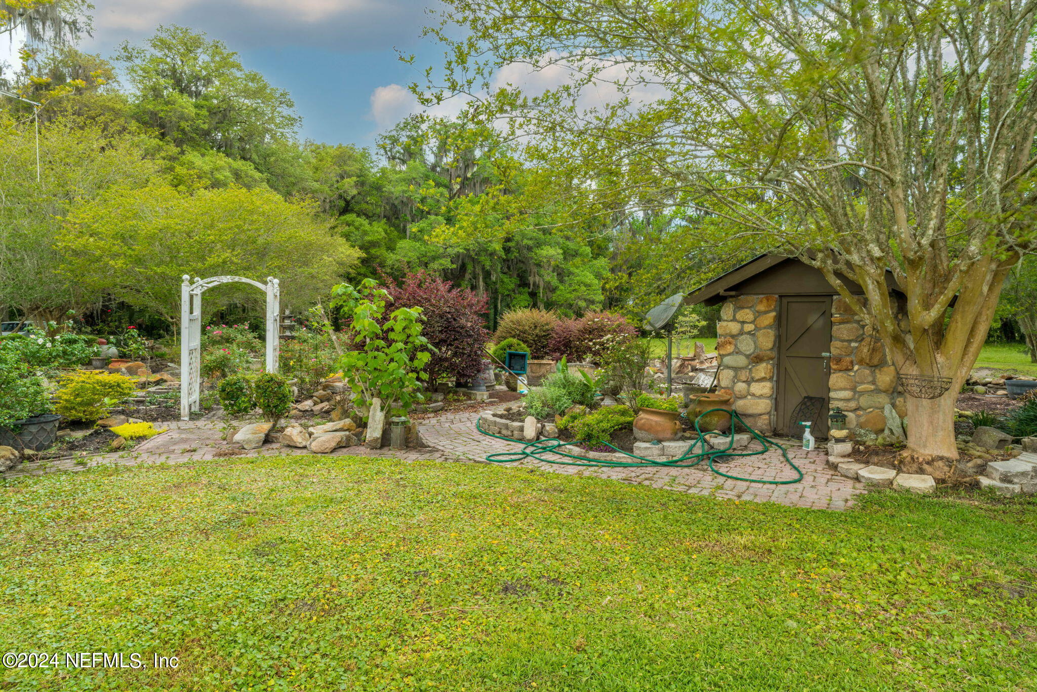 542284 Lem Turner Road Callahan, FL 32011 - Photo 73 of 84 a view of a garden with plants and large trees