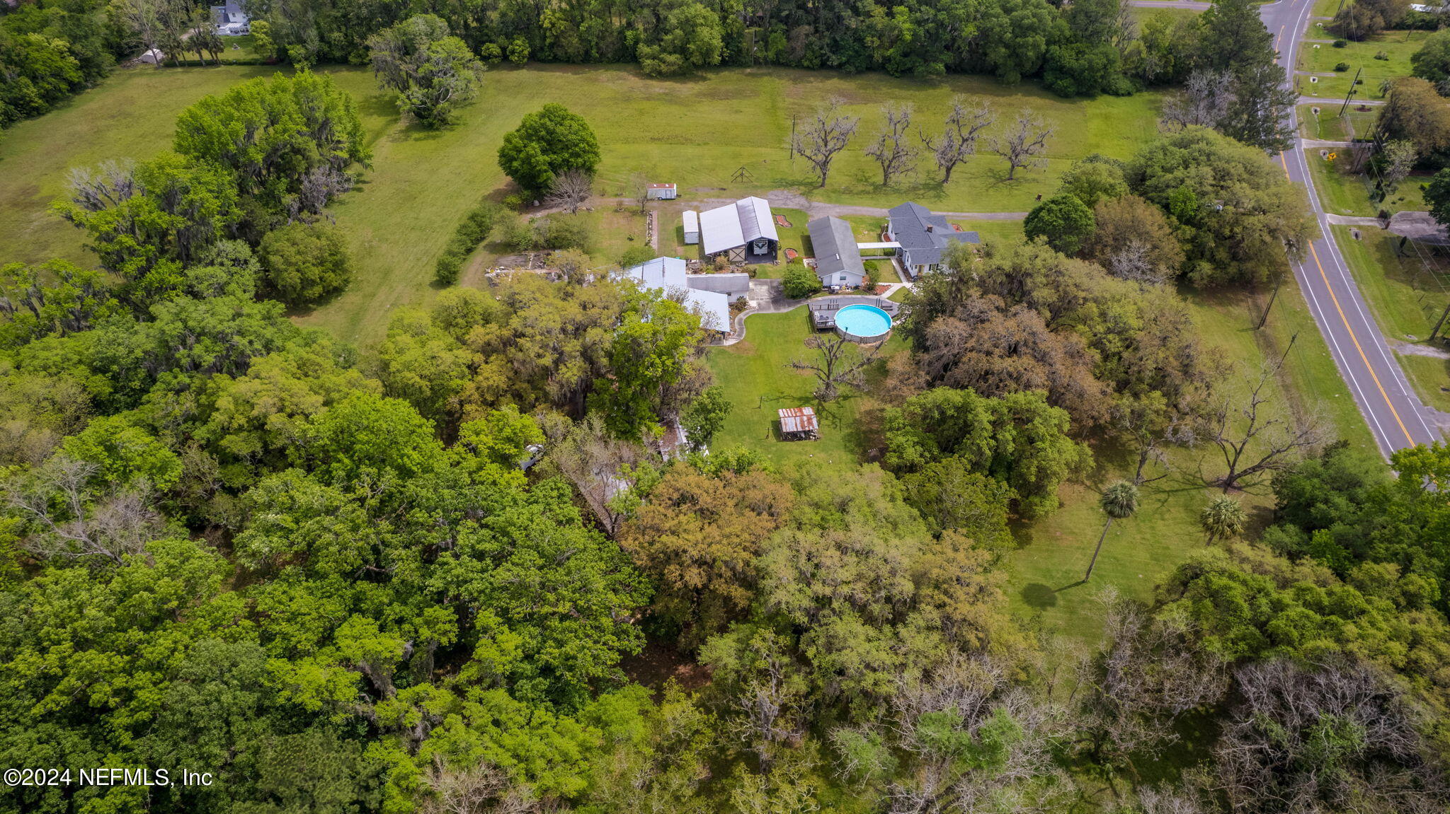 542284 Lem Turner Road Callahan, FL 32011 - Photo 77 of 84 a view of a lake with a building in the background