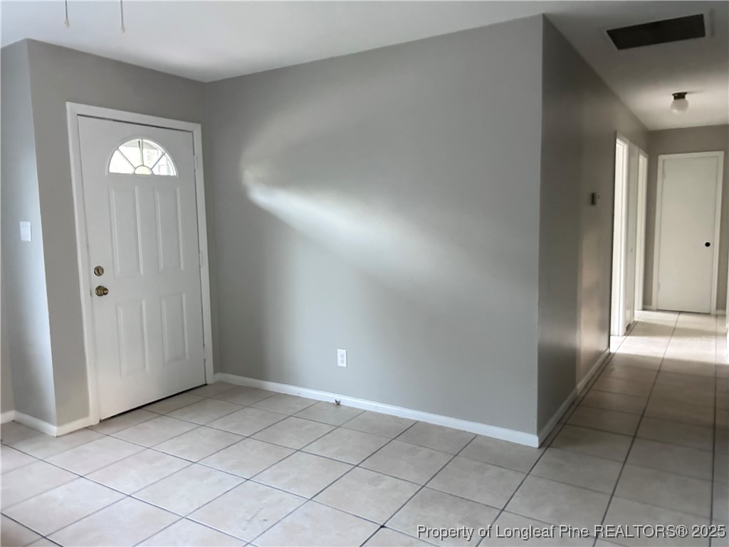 551 Alleghany Road Fayetteville, NC 28304 - Photo 4 of 13 an empty room with windows