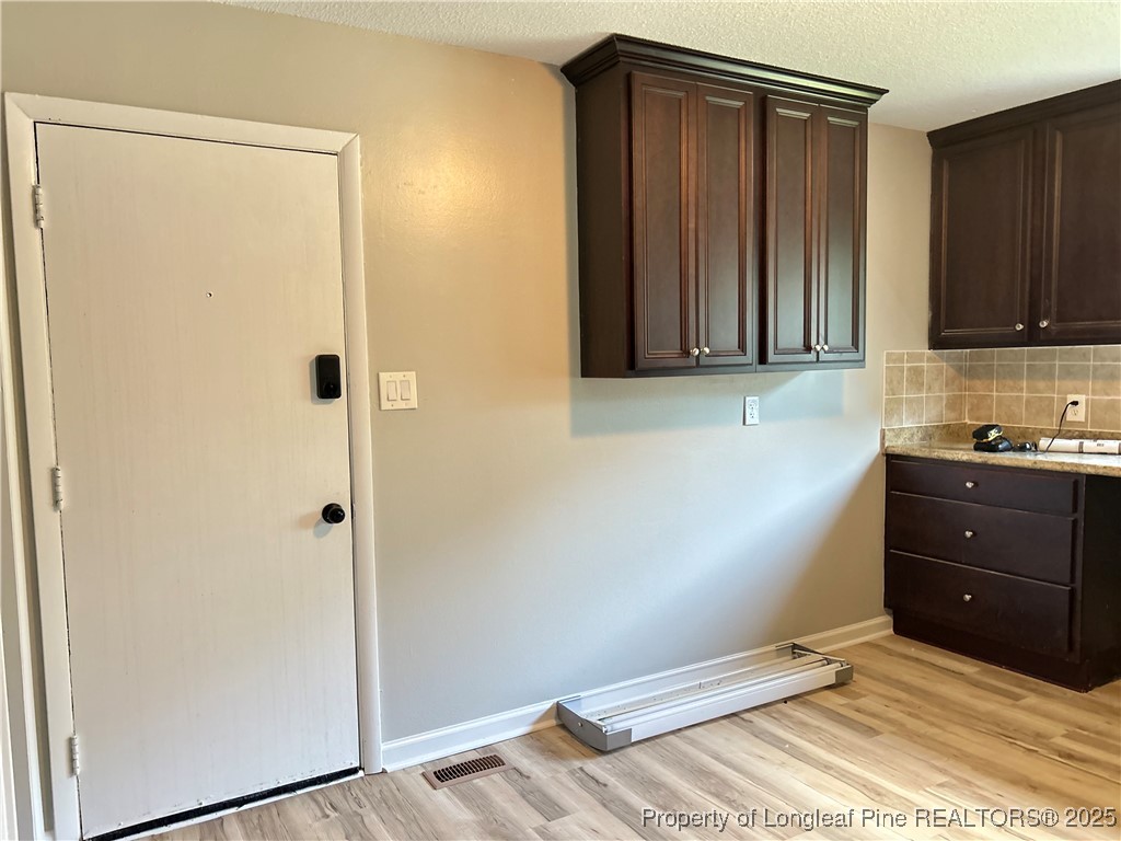 551 Alleghany Road Fayetteville, NC 28304 - Photo 9 of 13 a view of a closet area and bedroom