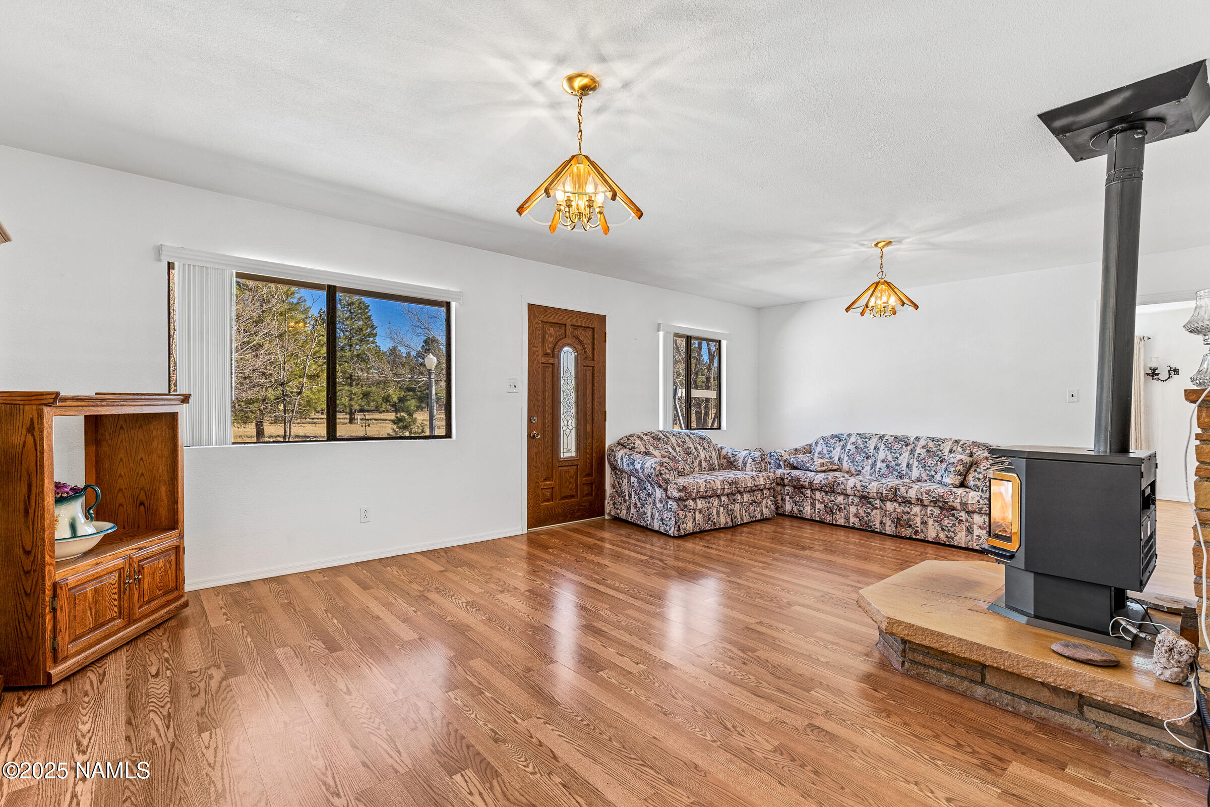 1843 Country Club Road Williams, AZ 86046 - Photo 15 of 36 a bedroom with a bed and a couch