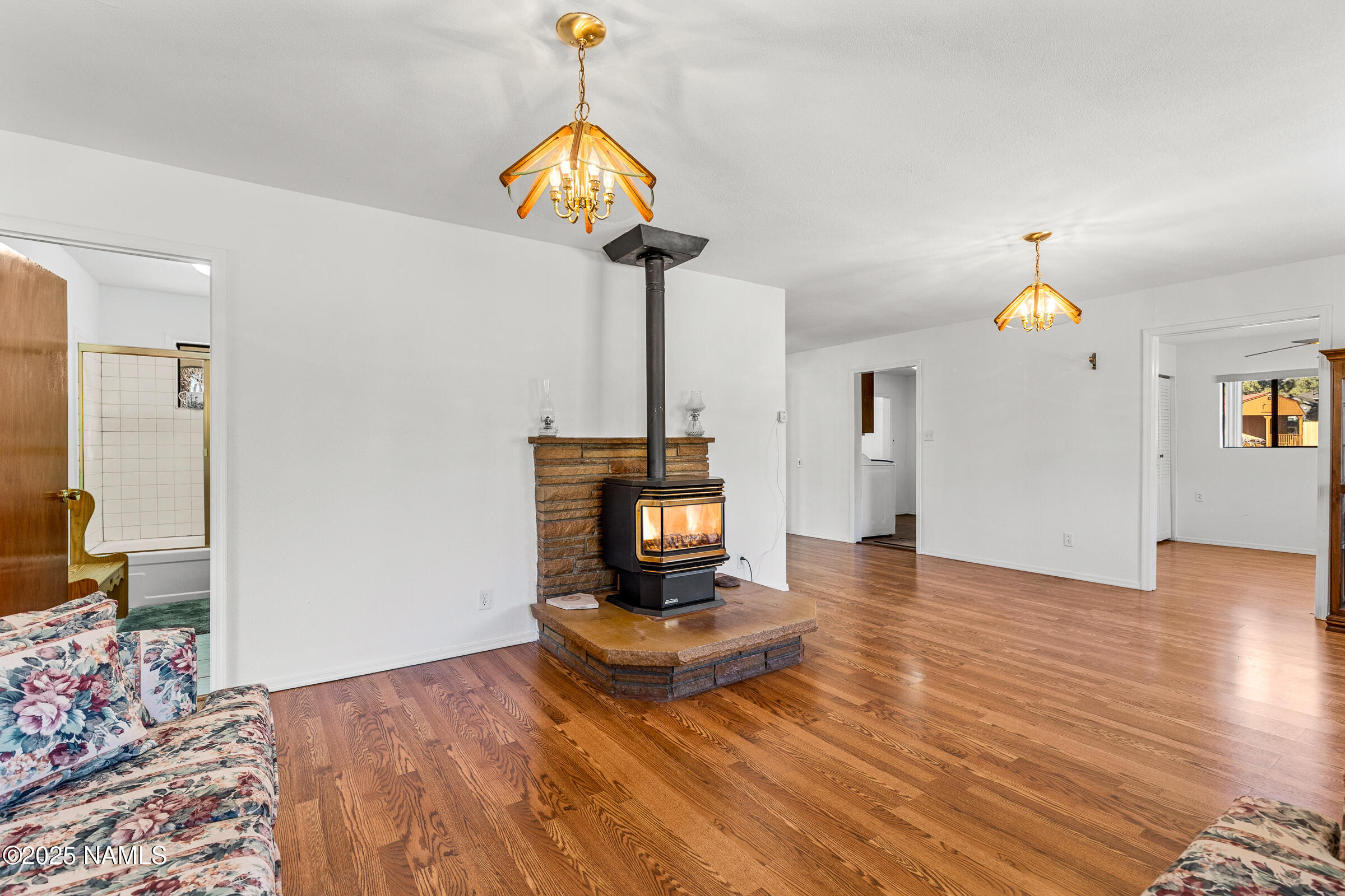 1843 Country Club Road Williams, AZ 86046 - Photo 17 of 36 a living room with furniture and a chandelier