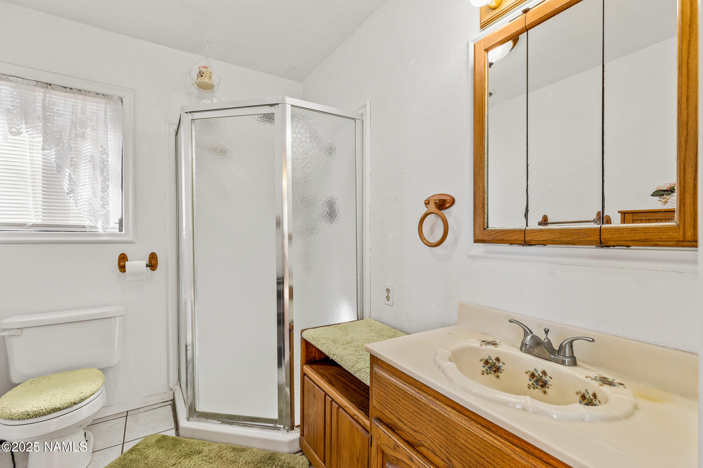 1843 Country Club Road Williams, AZ 86046 - Photo 20 of 36 a bathroom with a sink a toilet and a mirror