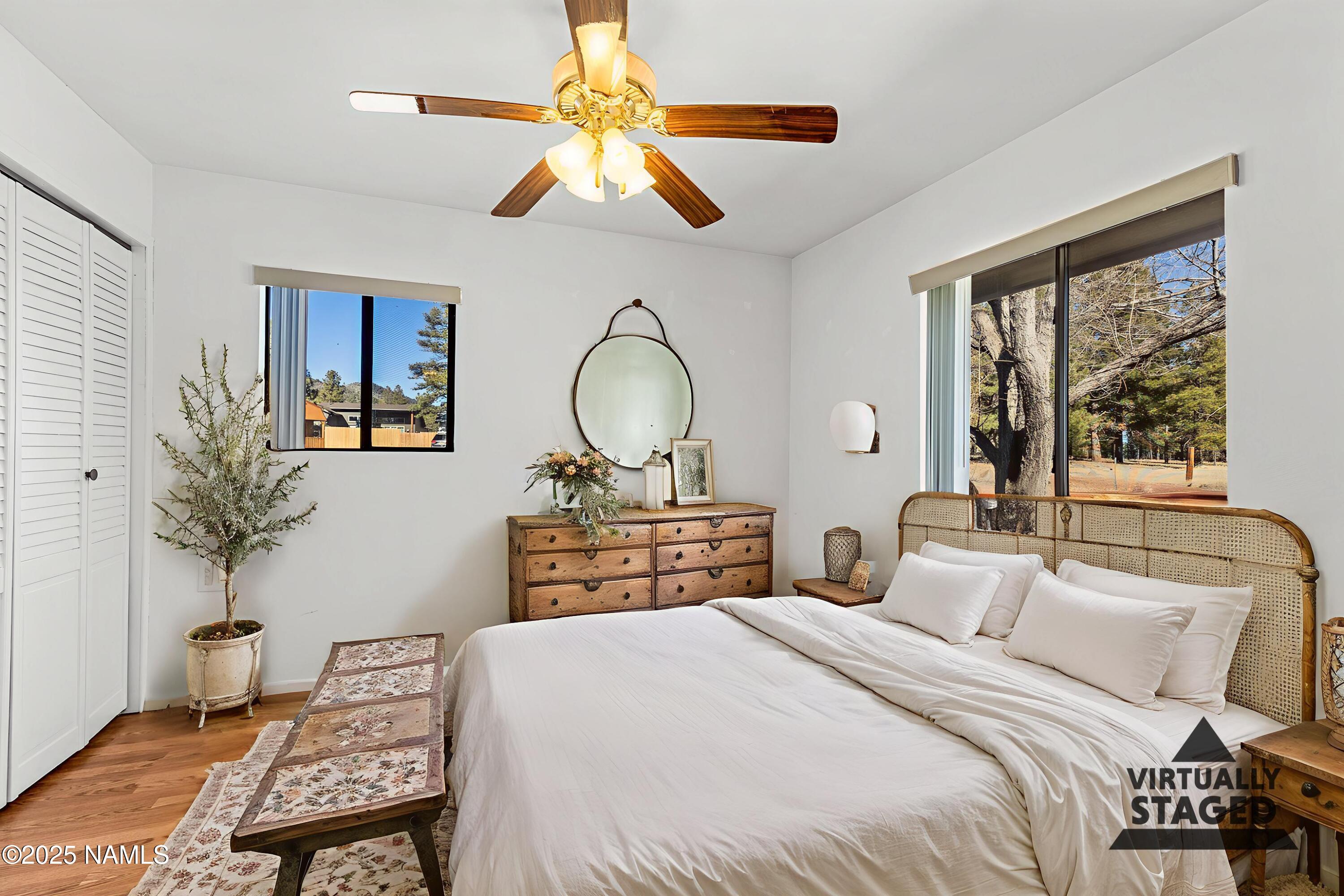 1843 Country Club Road Williams, AZ 86046 - Photo 24 of 36 a bedroom with a bed and a chandelier