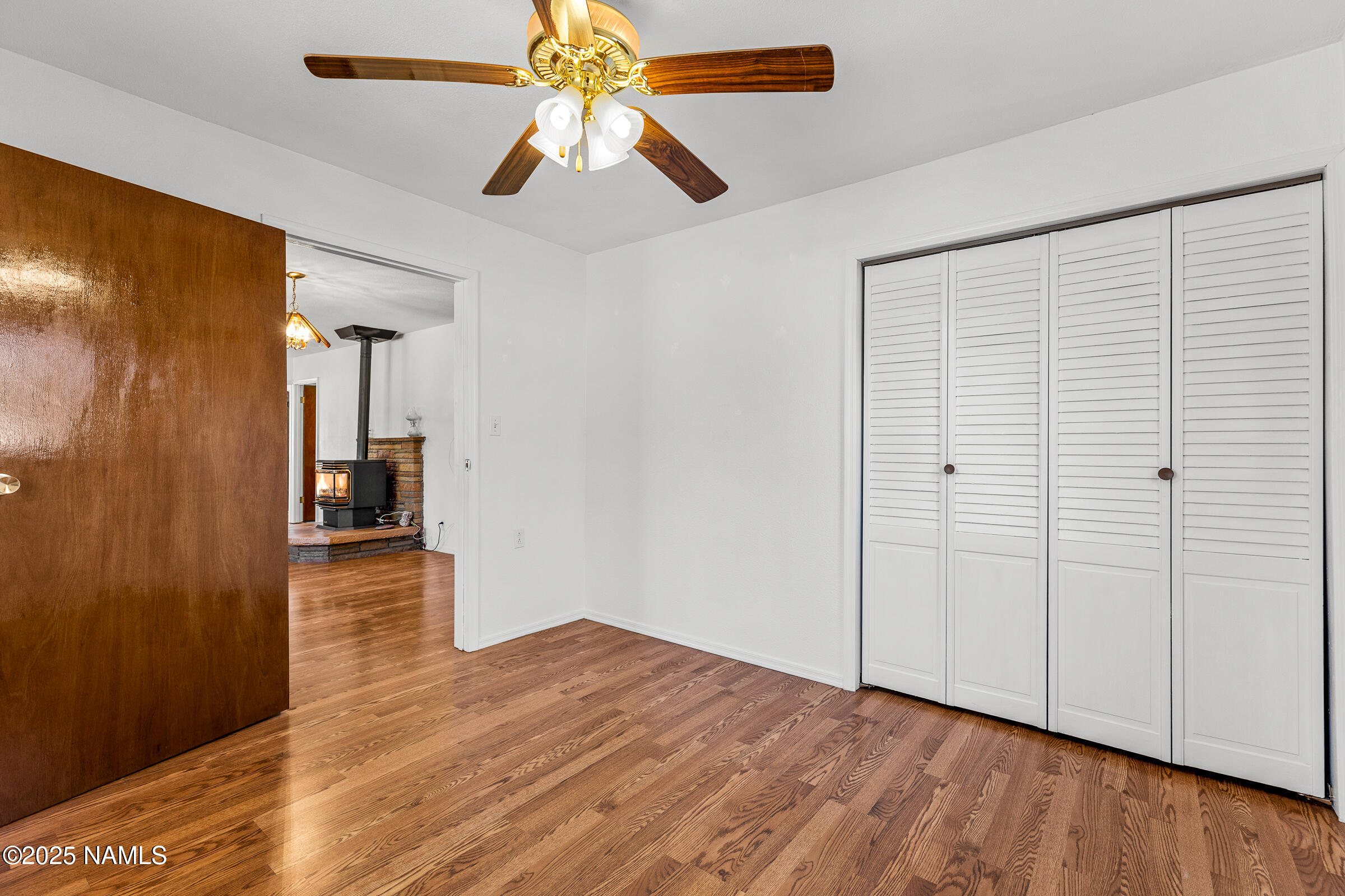 1843 Country Club Road Williams, AZ 86046 - Photo 25 of 36 wooden floor in an empty room with a window