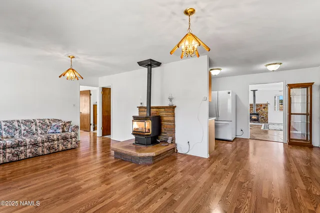 a view of a livingroom with furniture and a rug
