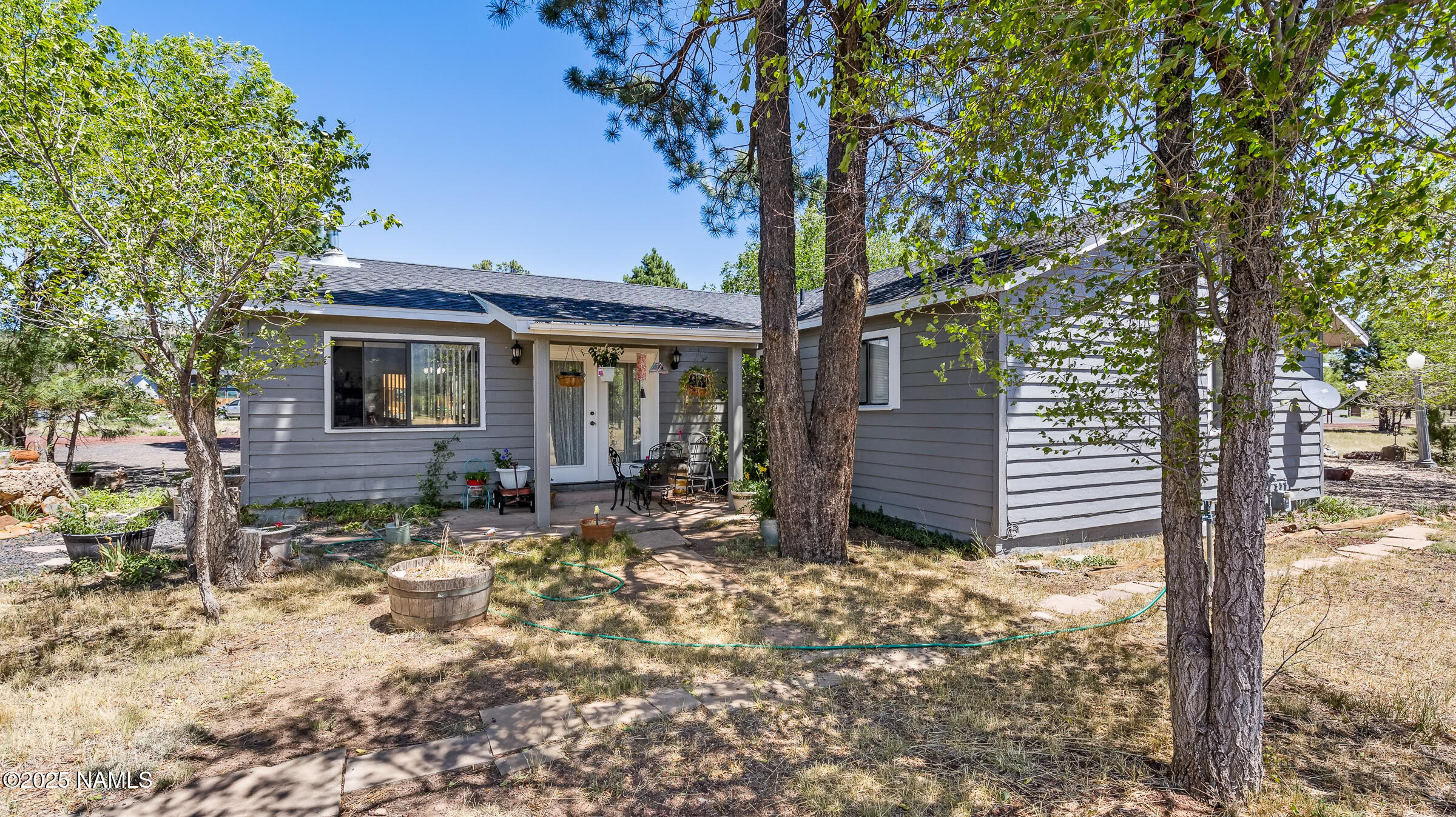 1843 Country Club Road Williams, AZ 86046 - Photo 7 of 36 a view of a house with a yard tree and wooden fence