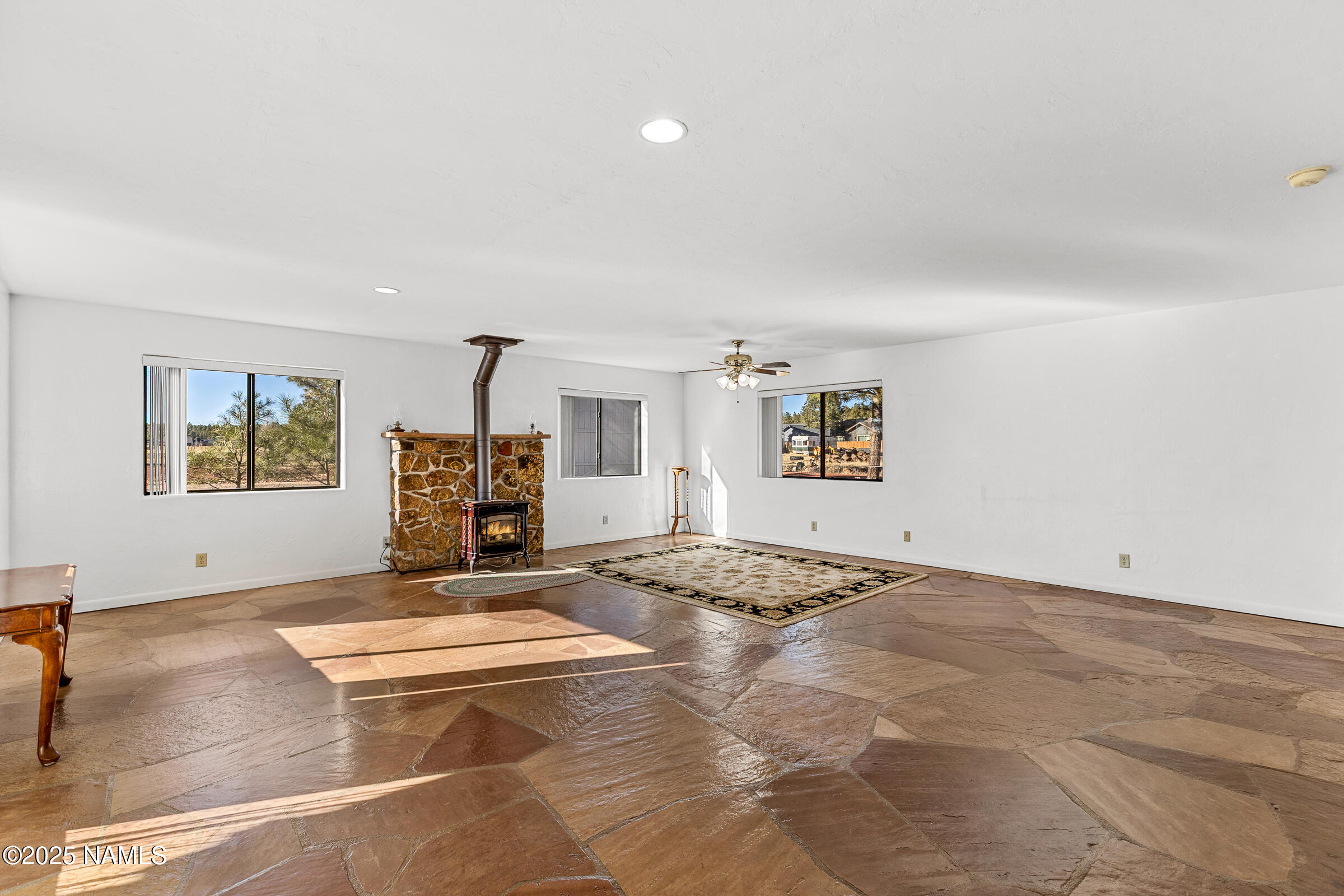 1843 Country Club Road Williams, AZ 86046 - Photo 10 of 36 a view of a livingroom with a hall and a stove top oven