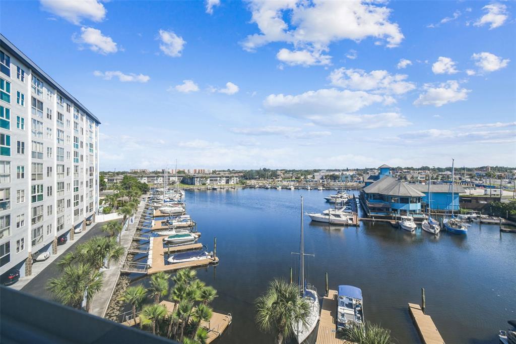 4939 Floramar Terrace, Unit 511 New Port Richey, FL 34652 - Photo 1 of 1 a view of a lake with chairs
