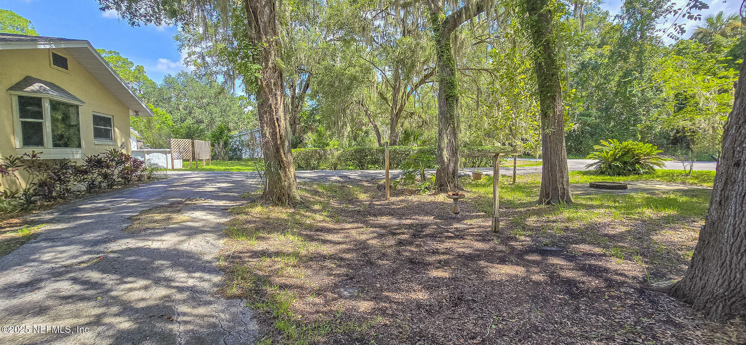 5 55th Street Yankeetown, FL 34498 - Photo 16 of 24 a view of a house with backyard and trees