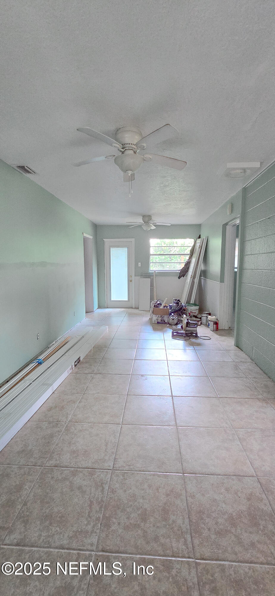 5 55th Street Yankeetown, FL 34498 - Photo 6 of 24 a view of a room with gym equipment and windows