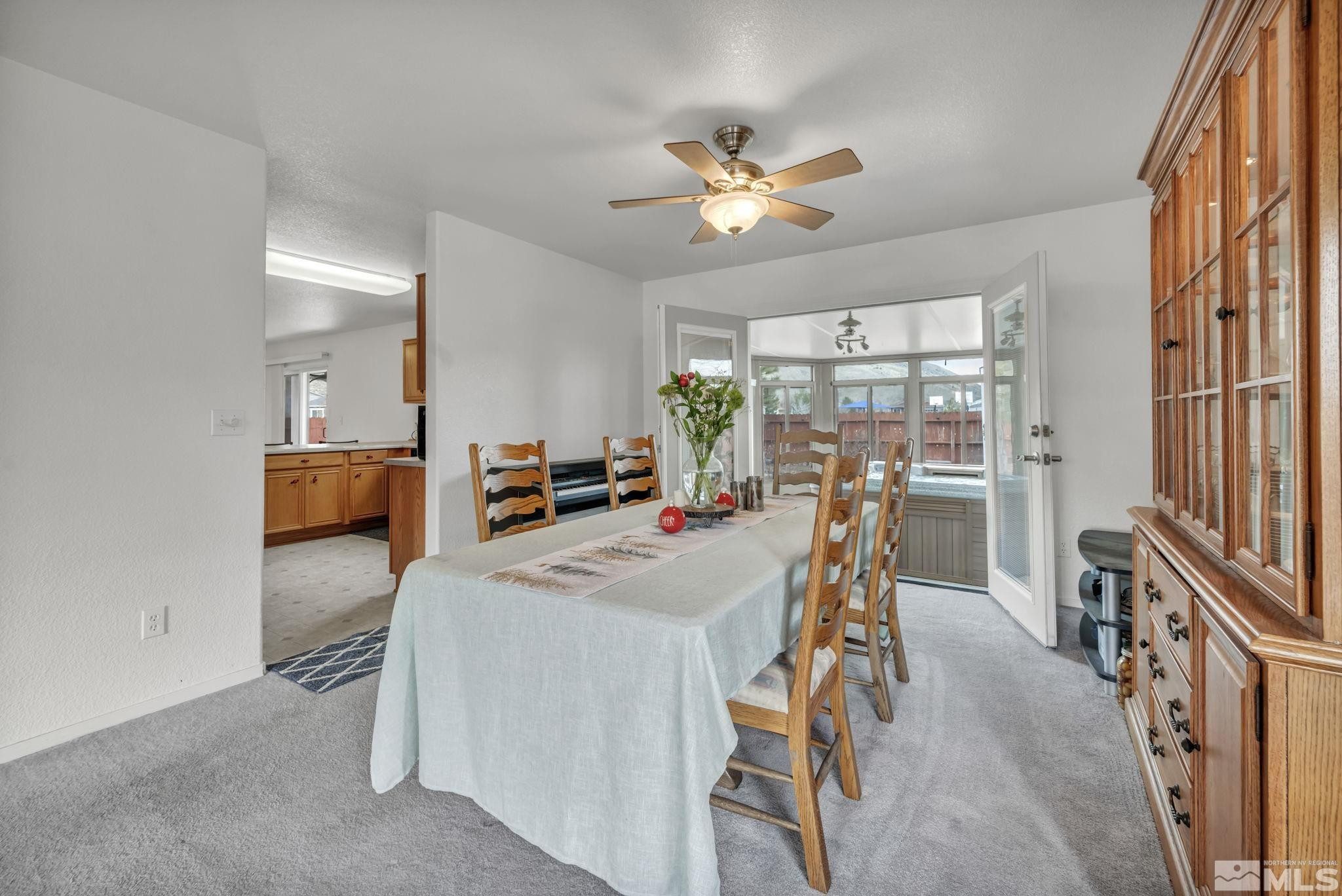 17795 Oakview Court Reno, NV 89508 - Photo 11 of 34 a view of a dining room with furniture and a chandelier