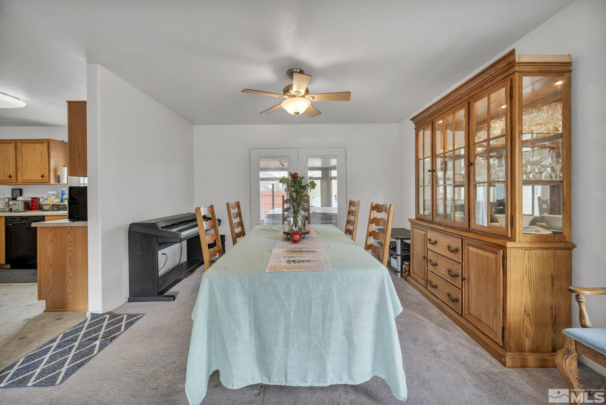 17795 Oakview Court Reno, NV 89508 - Photo 12 of 34 a large bedroom with a large bed and a chandelier