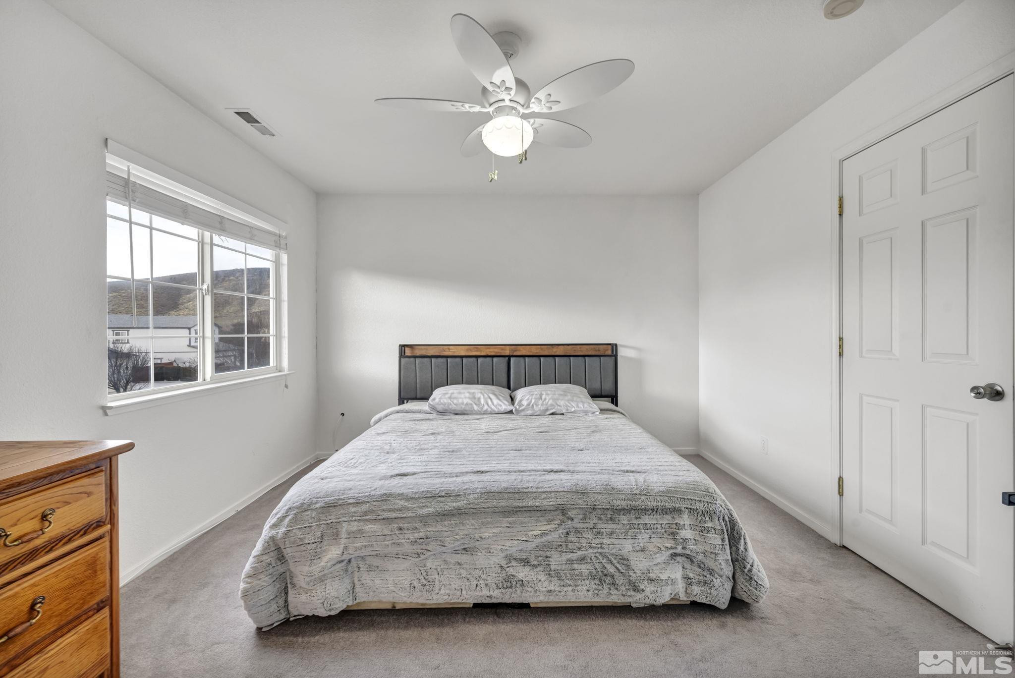 17795 Oakview Court Reno, NV 89508 - Photo 18 of 34 a bedroom with a bed and a window
