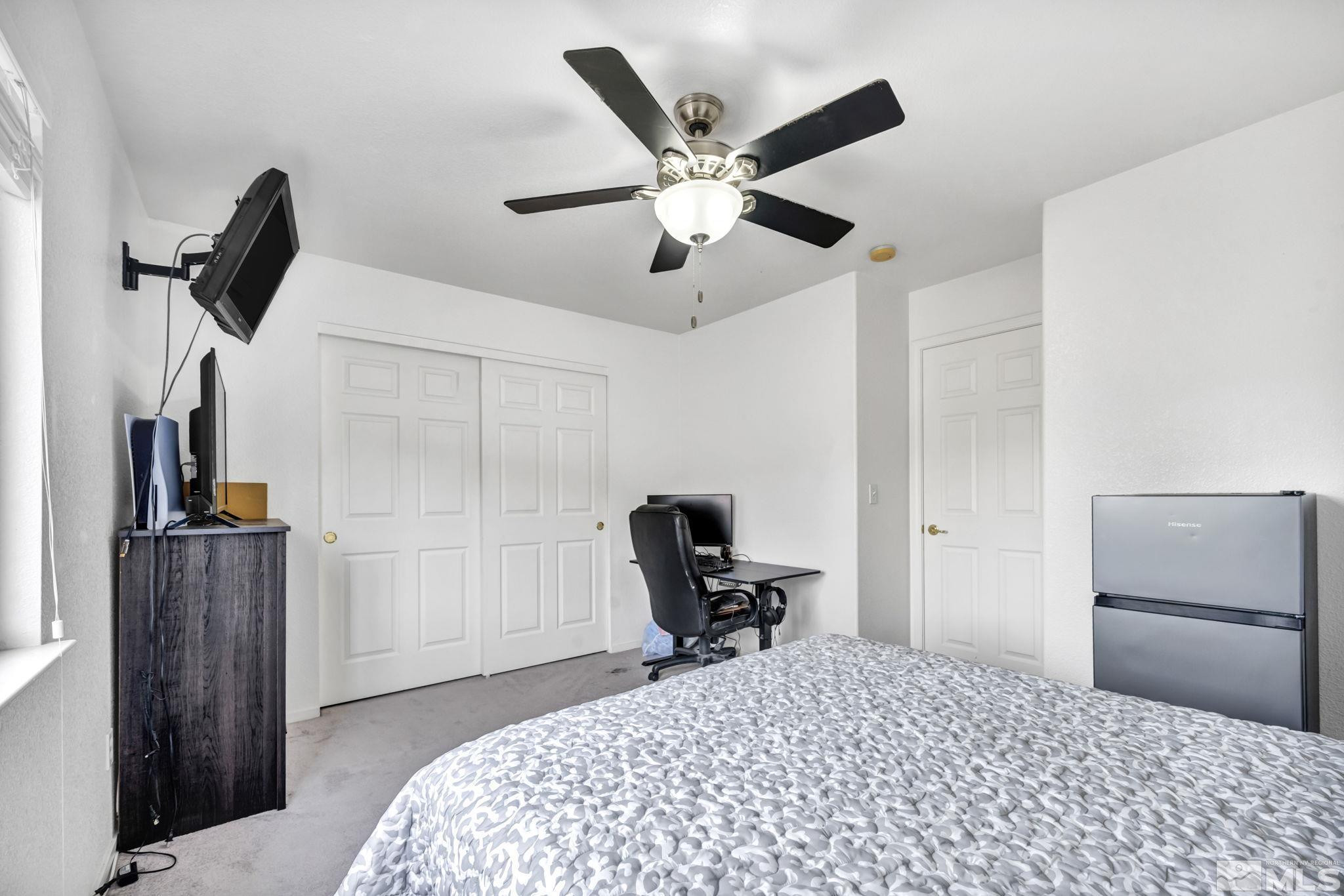 17795 Oakview Court Reno, NV 89508 - Photo 21 of 34 a bedroom with a bed and a chair