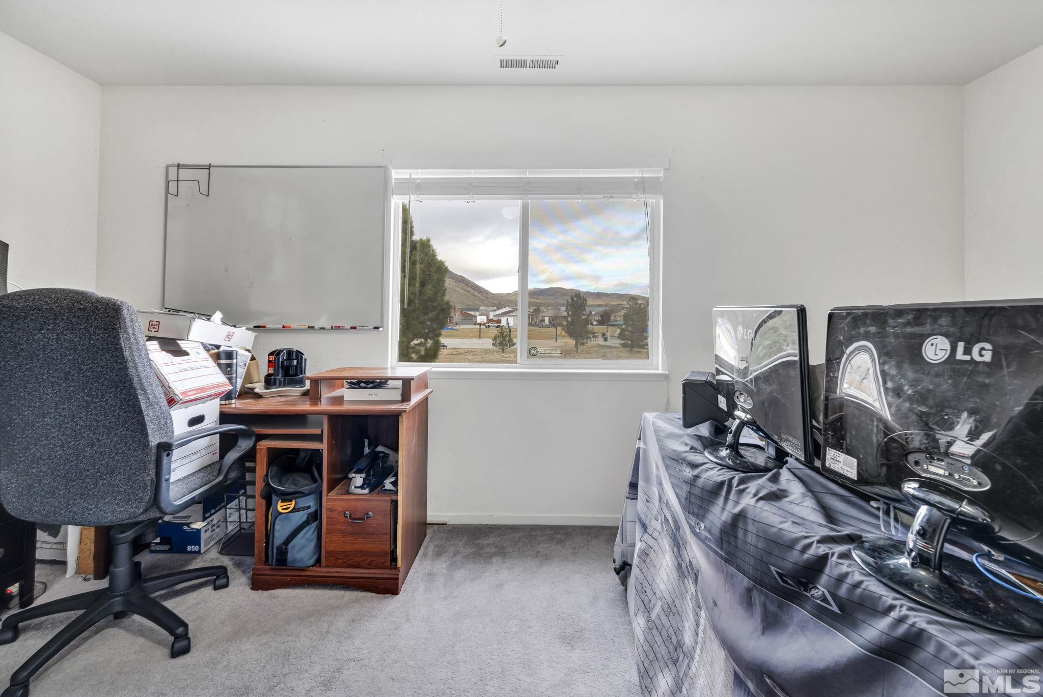 17795 Oakview Court Reno, NV 89508 - Photo 24 of 34 a view of a workspace with furniture and a window