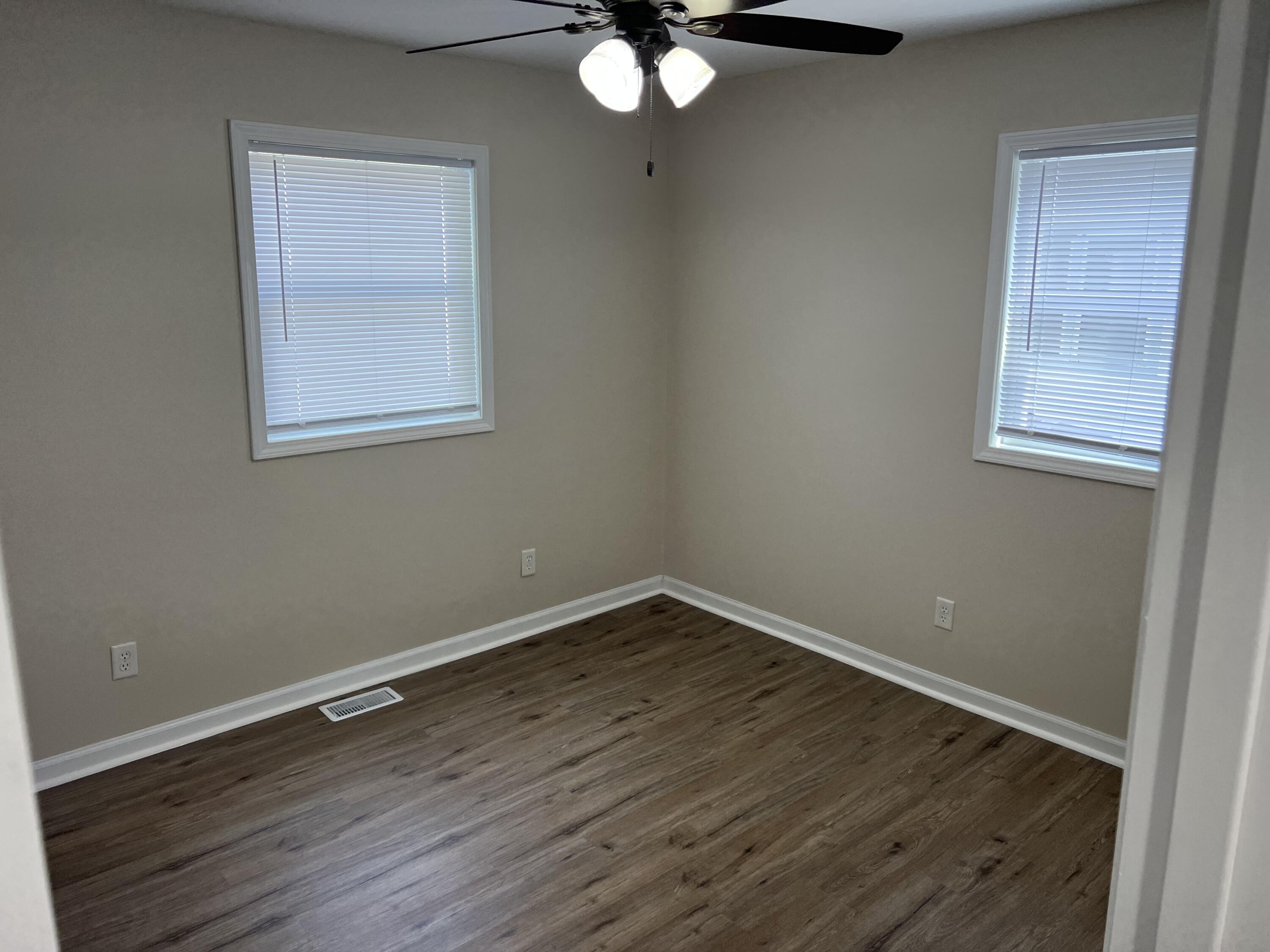 3851 Maple Street Hobart, IN 46342 - Photo 10 of 28 a view of an empty room with wooden floor and a window