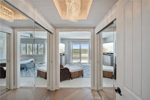 a spacious bedroom with a bed and large windows