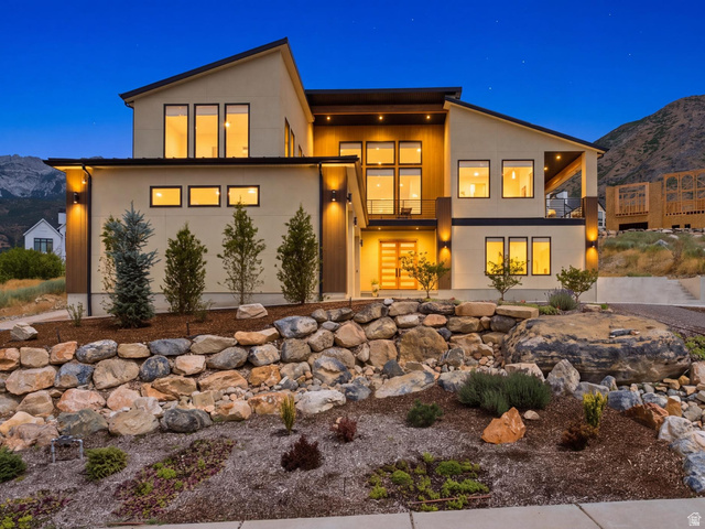 1445 Jacob Road Sandy, UT 84092 - Photo 3 of 52 Contemporary exterior with a multi-level design, extensive rock landscaping, and prominent mountain backdrop