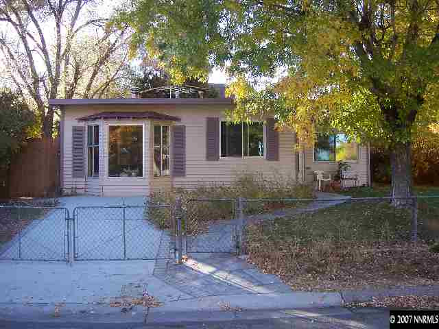 1685 Jackson Place Reno, NV 89512 - Photo 1 of 9 a view of a house with a yard