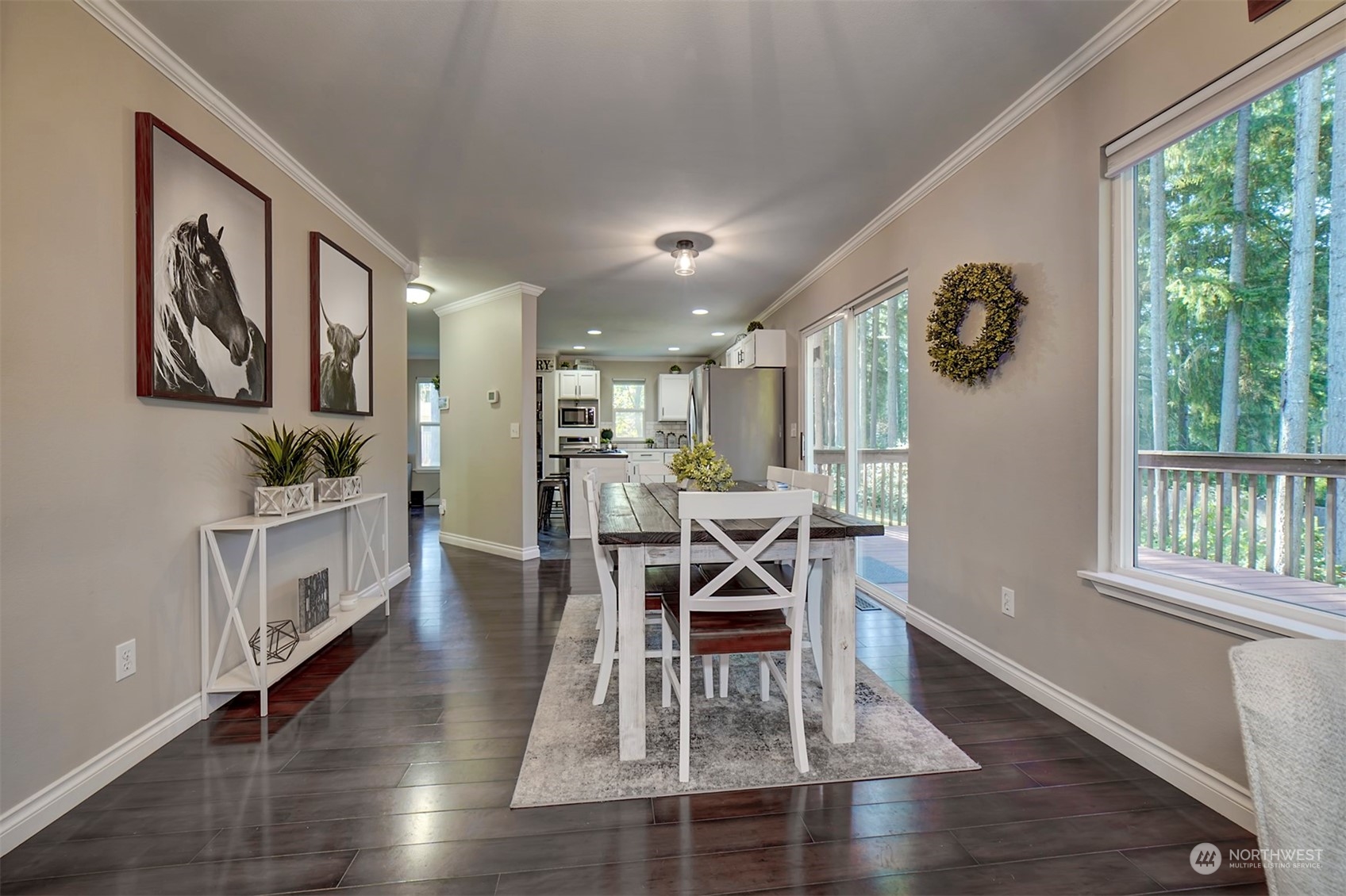 2016 Southeast Cedar Road Port Orchard, WA 98367 - Photo 12 of 30 a view of a dining room with furniture window and wooden floor