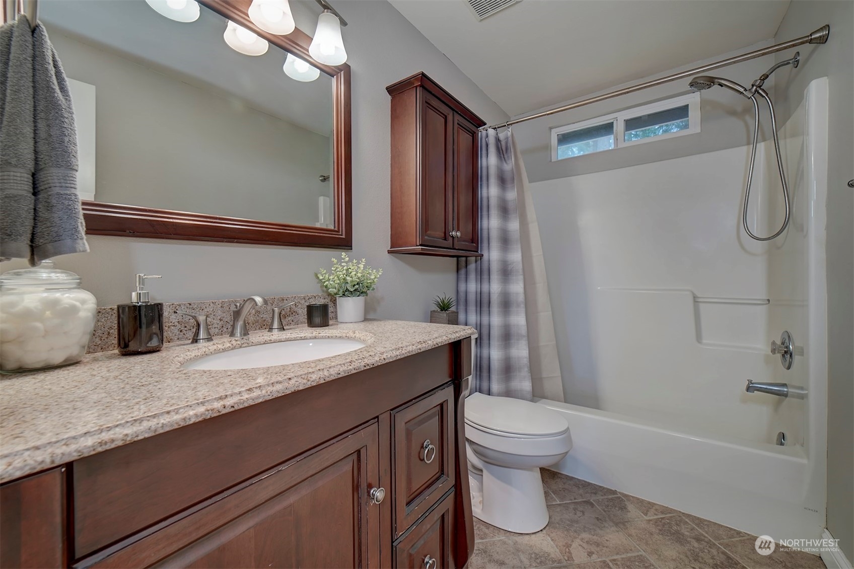 2016 Southeast Cedar Road Port Orchard, WA 98367 - Photo 22 of 30 a bathroom with a granite countertop sink toilet and shower