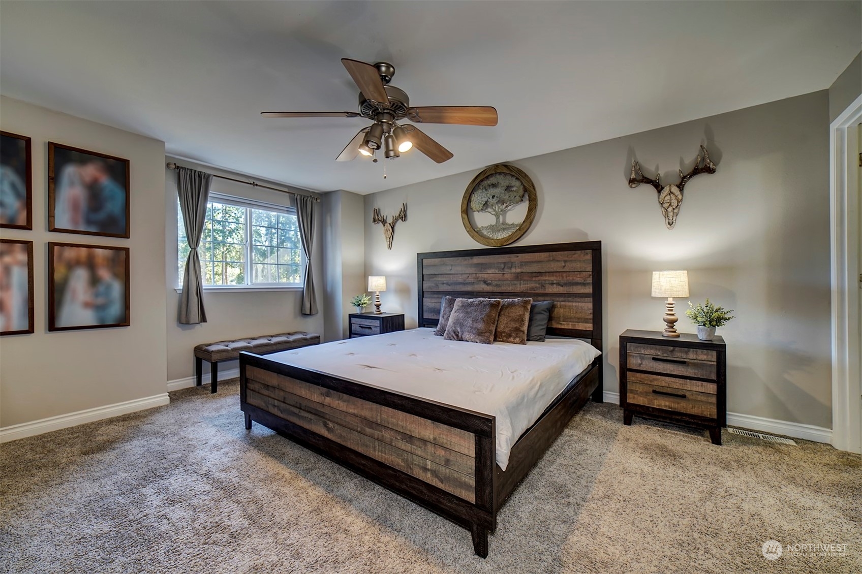 2016 Southeast Cedar Road Port Orchard, WA 98367 - Photo 24 of 30 a bedroom with a bed and a chandelier