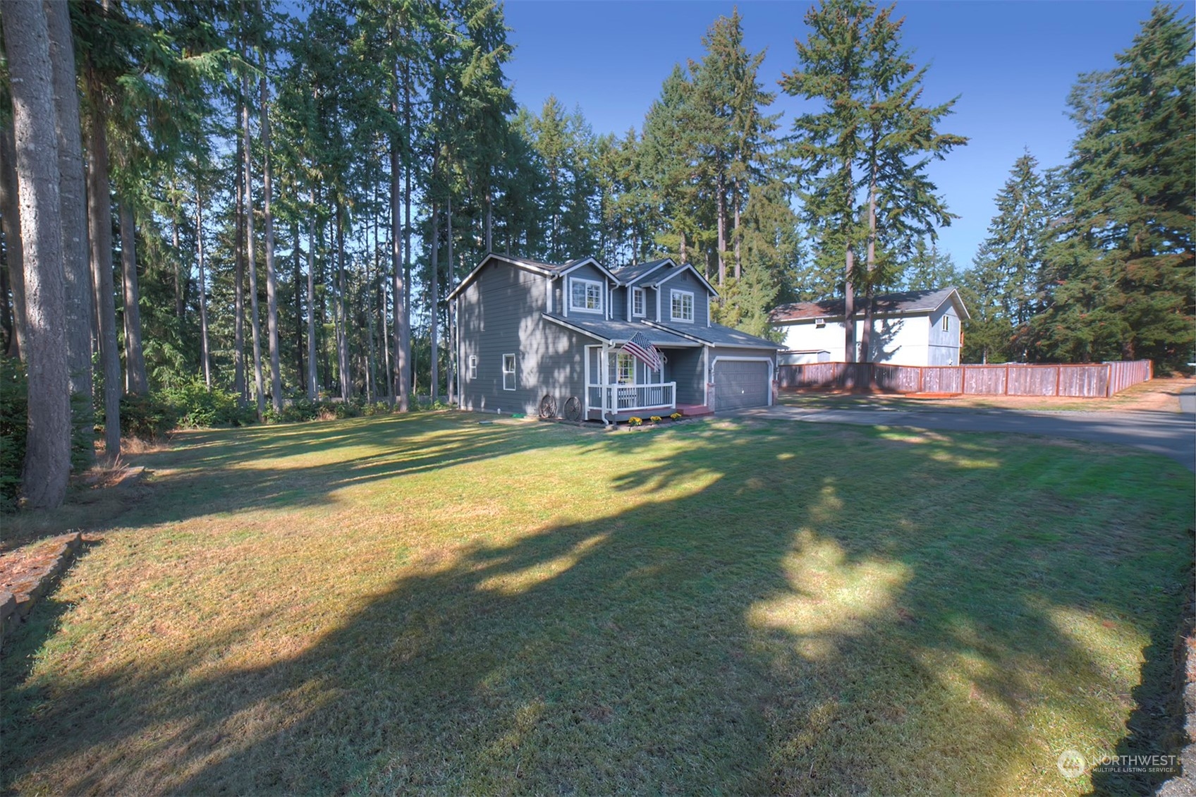 2016 Southeast Cedar Road Port Orchard, WA 98367 - Photo 3 of 30 a view of a house with a big yard and large trees