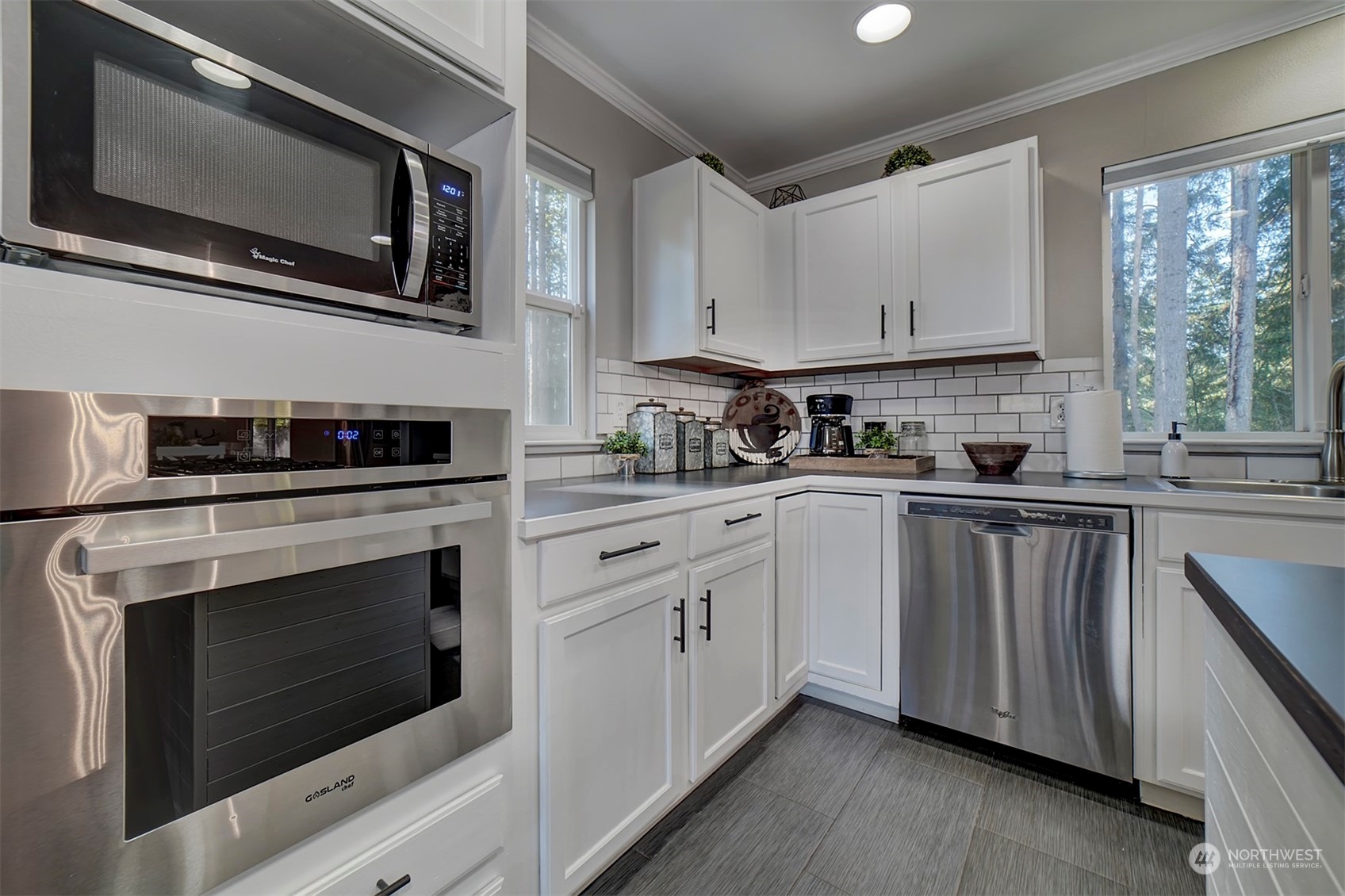 2016 Southeast Cedar Road Port Orchard, WA 98367 - Photo 7 of 30 a kitchen with cabinets stainless steel appliances and a sink