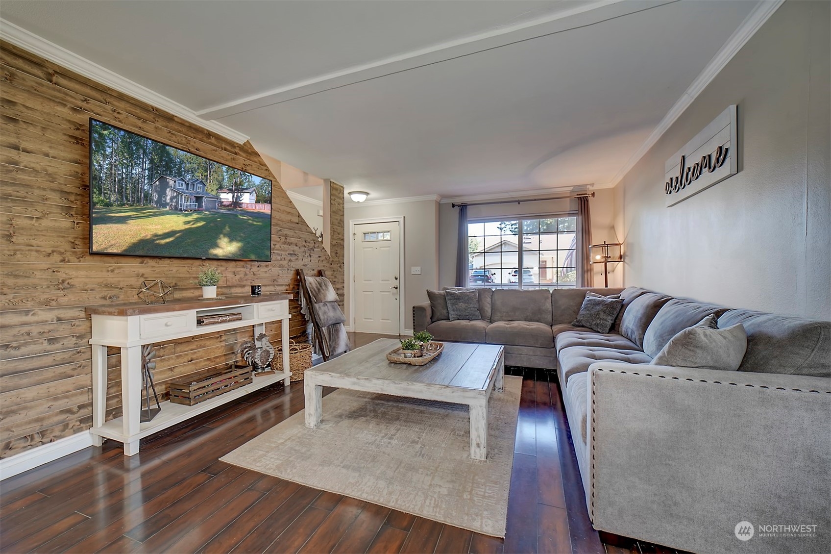 2016 Southeast Cedar Road Port Orchard, WA 98367 - Photo 10 of 30 a living room with furniture a flat screen tv and a fireplace