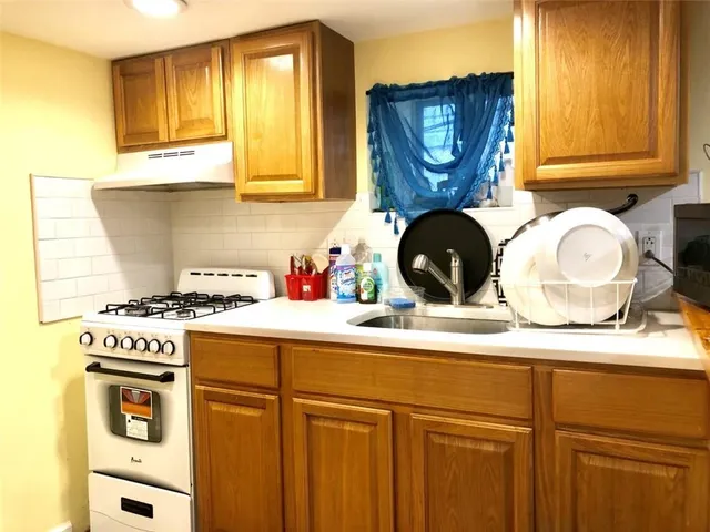 a view of a kitchen with kitchen island dining table and a couch
