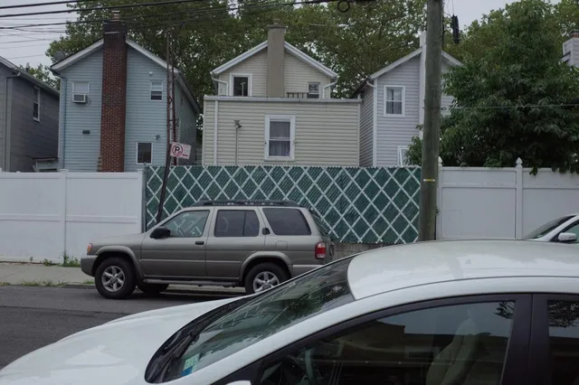 a view of a house with a street