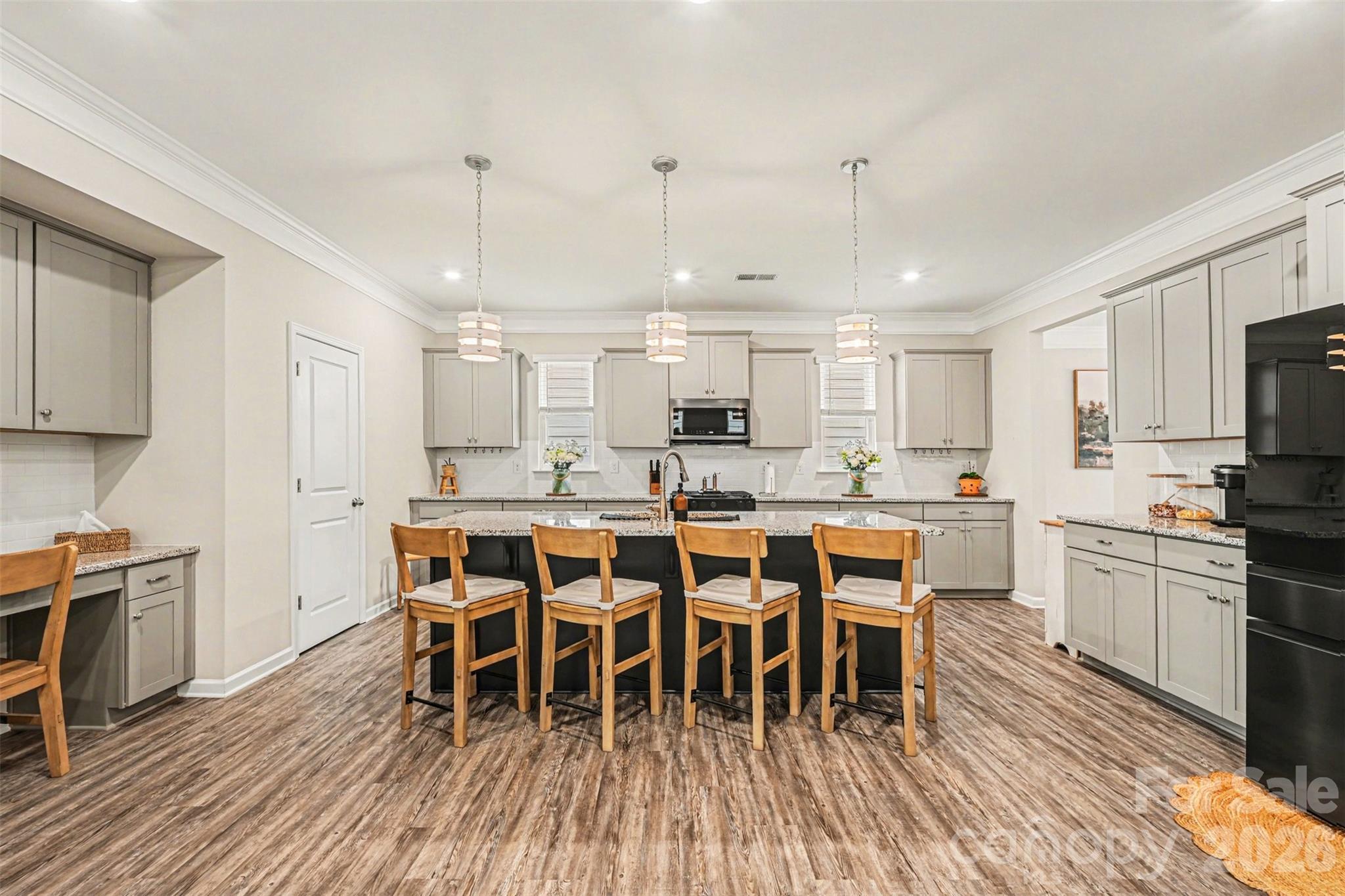 425 Kiser Lane Locust, NC 28097 - Photo 7 of 25 a large kitchen with a table and chairs