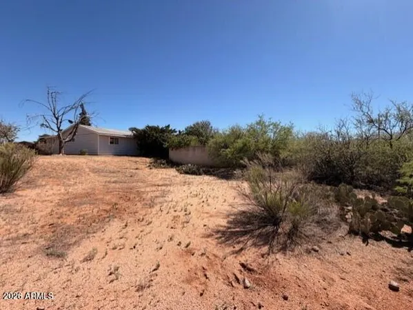 a view of a backyard of the house