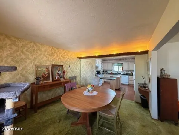 a kitchen with a table and chairs in it