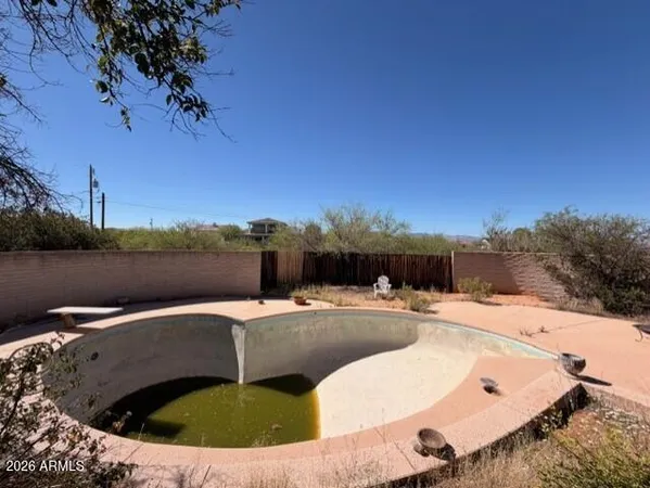 a view of a lake with couches and city view