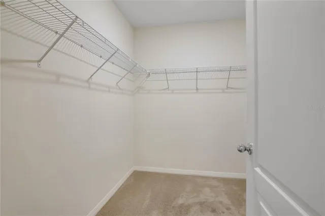 an aerial view of a house with a lake view